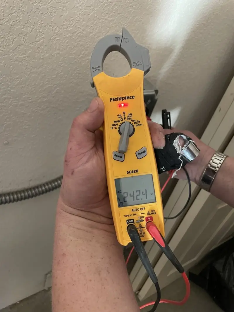 Voltage testing with clamp meter during Ceiling Fan Installation in Wilkesboro